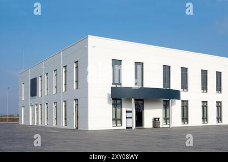White office building against the blue sky. Service center Stock Photo