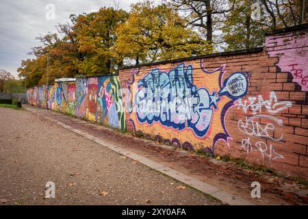 Graffiti on a brick wall in New Southgate, North London, UK Stock Photo