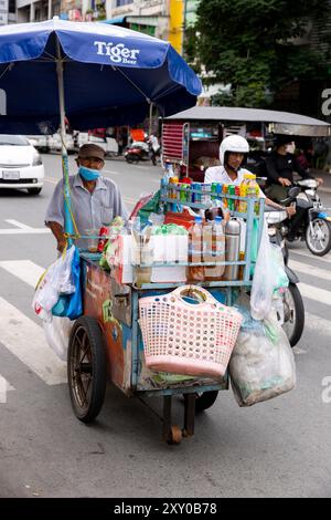 A mobile street vendor selling drink in Phnom Penh, Cambodia Stock Photo