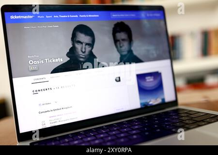 The ticketmaster website, shown on a computer laptop screen, displays information on the Oasis Live 2025 concert and tickets available to purchase on August 31, 2024. Stock Photo