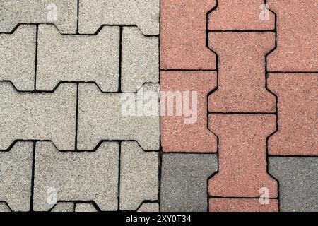 texture interlocking bricks for flooring, in interconnected concrete offer a functional and weather-resistant design. mortar-free installation. Stock Photo