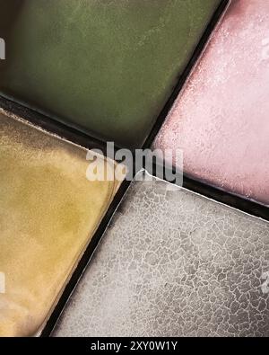 Close-up view of salt evaporation ponds showcasing the intriguing abstract patterns and textured surface, with varying colorful shades Stock Photo