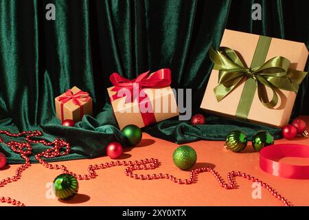 A stylish display of Christmas gifts wrapped in beige and adorned with red and green ribbons, set against a plush green velvet background, surrounded Stock Photo