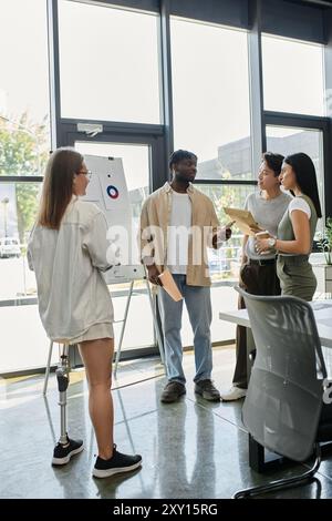A diverse group of colleagues collaborates in a contemporary office setting. Stock Photo