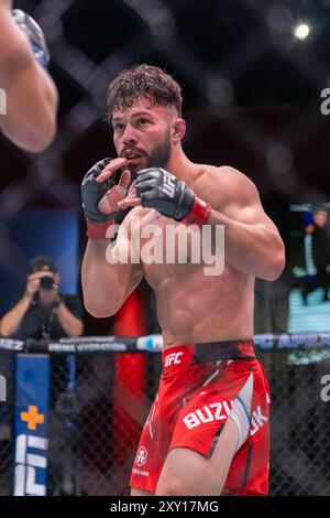 UFC Featherweight Dennis Buzukja fighting during UFC on ESPN 62 at UFC Apex Stock Photo