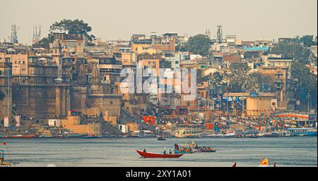 Varanasi, Uttar Pradesh, India. Boats Floating Near Rana Mahal Ghat, Darbhanga Ghat And Dashashwamedh Ghat In Early Morning. Many Hindu Temples. View Stock Photo