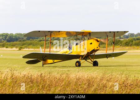 de Havilland Tiger Moth II, G-ANKK, taxiing out, Little Gransden airfield, Cambridgeshire, England Stock Photo