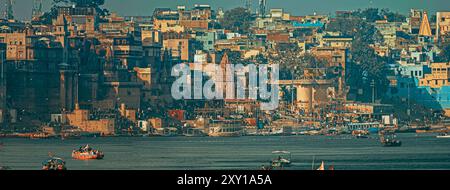 Varanasi, Uttar Pradesh, India. Boats Floating Near Rana Mahal Ghat, Darbhanga Ghat And Dashashwamedh Ghat In Early Morning. Many Hindu Temples. View Stock Photo