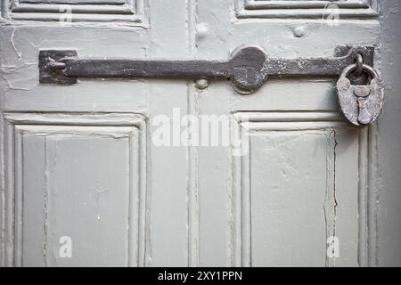 A large padlock and bar on the outside of a door at Stamford, England. Stock Photo