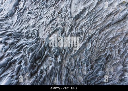 Abstract weathered frozen natural ice cave textured background Stock Photo