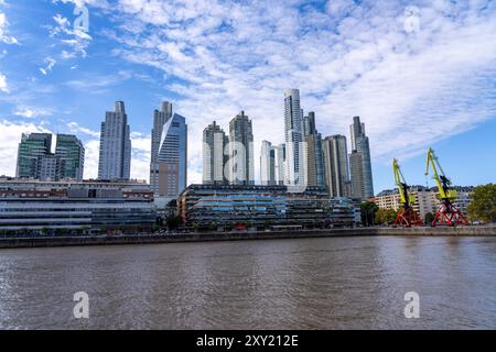 The skyline of Puerto Madero over Dock 3 in Buenos Aires, Argentina, including the Alvear Tower, tallest building in Argentina.  Also shown are the Mu Stock Photo