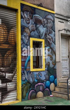 A mural painted on mosaic tile around a window in the wall of a building in Caminito, La Boca, Buenos Aires, Argentina. Stock Photo