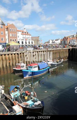 Whitby North Yorkshire UK 21st August 21 2024 Whitby a British seaside town with boats moored in the harbour on a hot summers Stock Photo