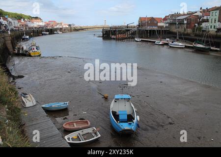 Whitby North Yorkshire UK 21st August 21 2024 Whitby a British seaside town with boats moored in the harbour on a hot summers Stock Photo