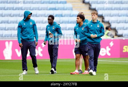 Coventry City players inspect the pitch before the Carabao Cup second round match at the Coventry Building Society Arena, Coventry. Picture date: Tuesday August 27, 2024. Stock Photo