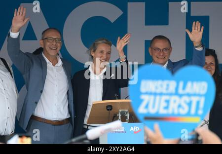 Bautzen, Germany. 27th Aug, 2024. Jörg Urban (l-r), Chairman of the AfD in Saxony, Alice Weidel, AfD Federal Chairman, and Tino Chrupalla, AfD Federal Chairman, stand on stage at an AfD campaign event for the state election in Saxony at the Kornmarkt. Credit: Robert Michael/dpa/Alamy Live News Stock Photo