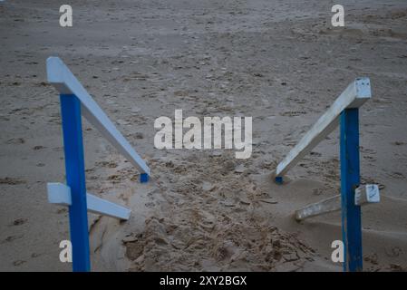 Steps Disappearing into Sand at the Beach Stock Photo