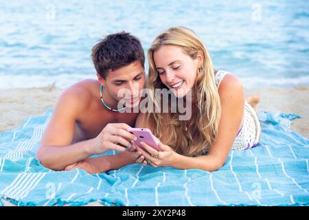 Young couple using smartphone app outdoors. Stock Photo