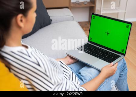 Telemedicine Consultation: patient interacts with doctor by laptop with chroma key screen Stock Photo