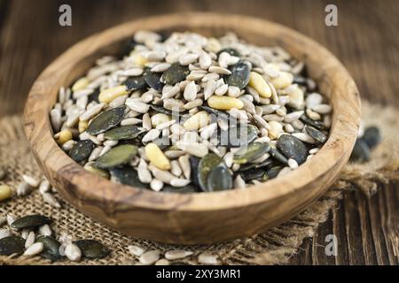 Old wooden table with mixed Seeds (close-up shot, selective focus) Stock Photo