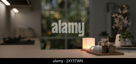 A close-up image of a kitchen countertop with a cozy atmosphere, illuminated by a table lamp, ready for your product display in a contemporary kitchen Stock Photo