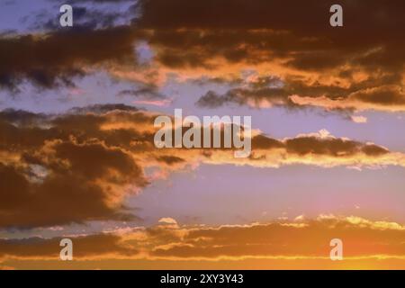 Heavenly landscape with dramatic crimson sunset clouds Stock Photo