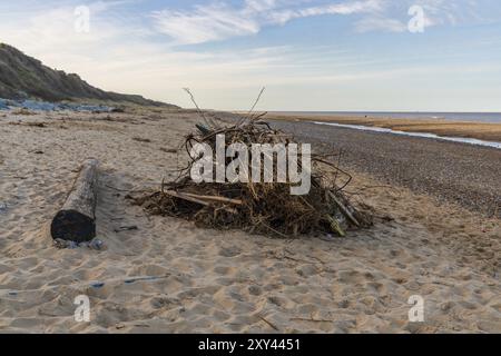 Wood on the beach of California, near Caister-on-Sea, Norfolk, England, UK Stock Photo