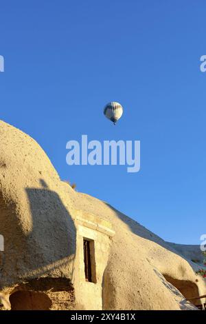 Balloon over the town of Goreme in Cappadocia, Turkey, Asia Stock Photo