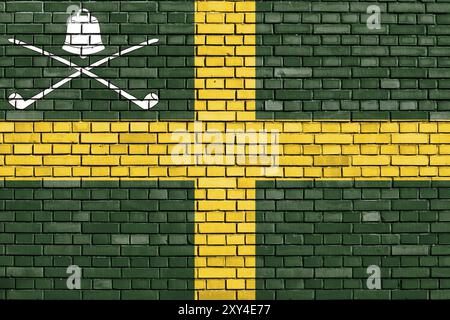 Flag of Wreay painted on brick wall Stock Photo