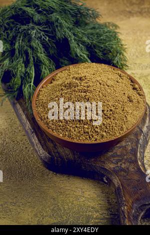 Dried dill, in a ceramic bowl, a bunch of fresh dill, seasoning, top view, no people Stock Photo