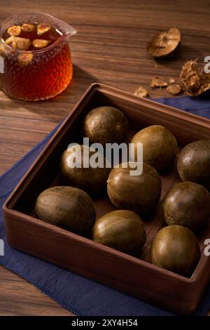 Chinese traditional medicine monk fruit, wooden background atmosphere Stock Photo