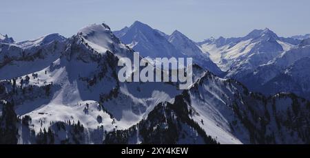 Mount Rophaien and other snow covered mountains seen from mount Fronalpstock Stock Photo