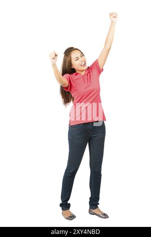 Isolated on white background full length profile of a beautiful Asian woman wearing casual clothes, eyes closed, fists and arms raised in the air cele Stock Photo