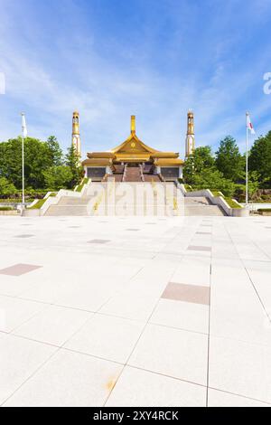 Centered wide angle vertical view of courtyard and front entrance of the World Shrine headquarters for Sukyo Mahikari religion on a beautiful blue sky Stock Photo