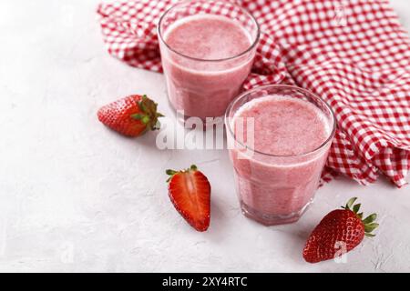 Strawberry milkshake or smoothie with oatmeal in a glass, top view copy space Stock Photo
