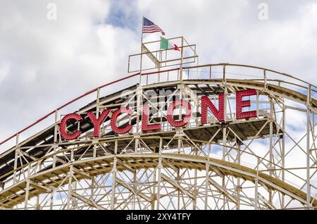 Cyclone Wooden Rollercoaster Red Logo with American Italian flag on the top, Close-up, Luna Park Amusement Park, Coney island, Brooklyn, New York City Stock Photo