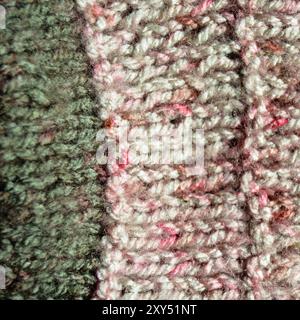 Pattern fabric made of wool. Handmade knitted fabric red and white wool background texture Stock Photo