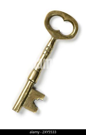 Old brass shiny skeleton keys isolated on white background Stock Photo