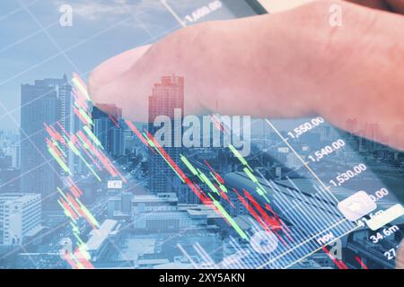 Double exposure, macro close up a man checking stock market on tablet, smartphone Stock Photo