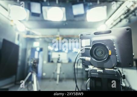 Lens of a film camera in an television broadcasting studio, spotlights and equipment Stock Photo