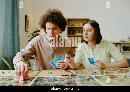 Young Couple Playing Fantasy Tabletop Game Stock Photo