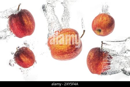 Apples falling under water with a splash. Background Stock Photo
