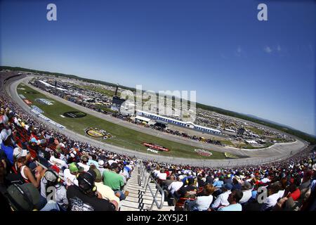 The Monster Energy NASCAR Cup Series cars race down the frontstretch during the GEICO 500 at Talladega Superspeedway in Talladega, Alabama Stock Photo