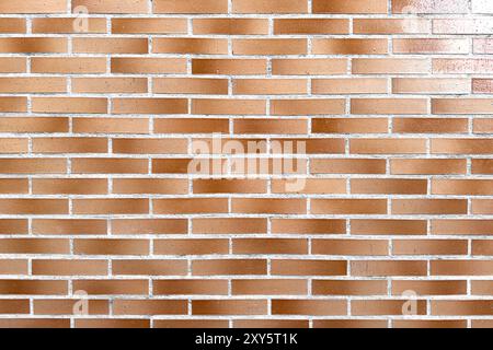 Smooth brown brick exterior wall as abstract architectural background Stock Photo