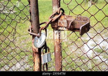 Locked gate on a private property Stock Photo