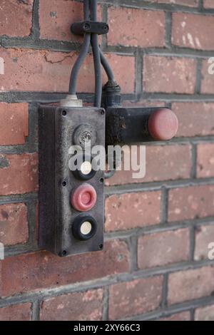 Emergency switch on the facade of a warehouse in Magdeburg harbour Stock Photo
