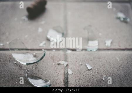 Piece of broken glass on the floor, wine bottle Stock Photo