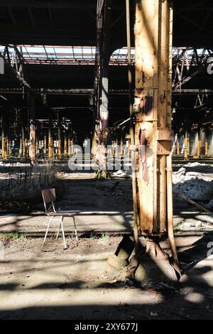 Chair in a disused factory Stock Photo