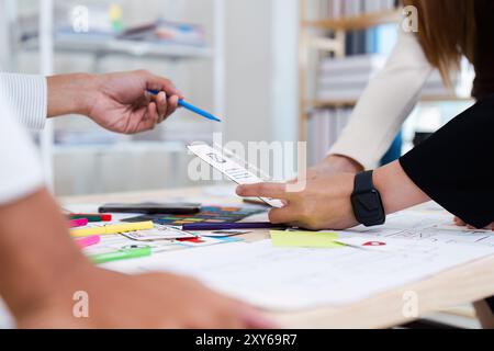 Creative Team Collaborating on UX UI Design Project with Wireframes and Prototypes Stock Photo