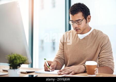 Business man, computer and notebook for writing notes, planning and drawing sketch with glasses. Graphic designer, technology and design in office for Stock Photo